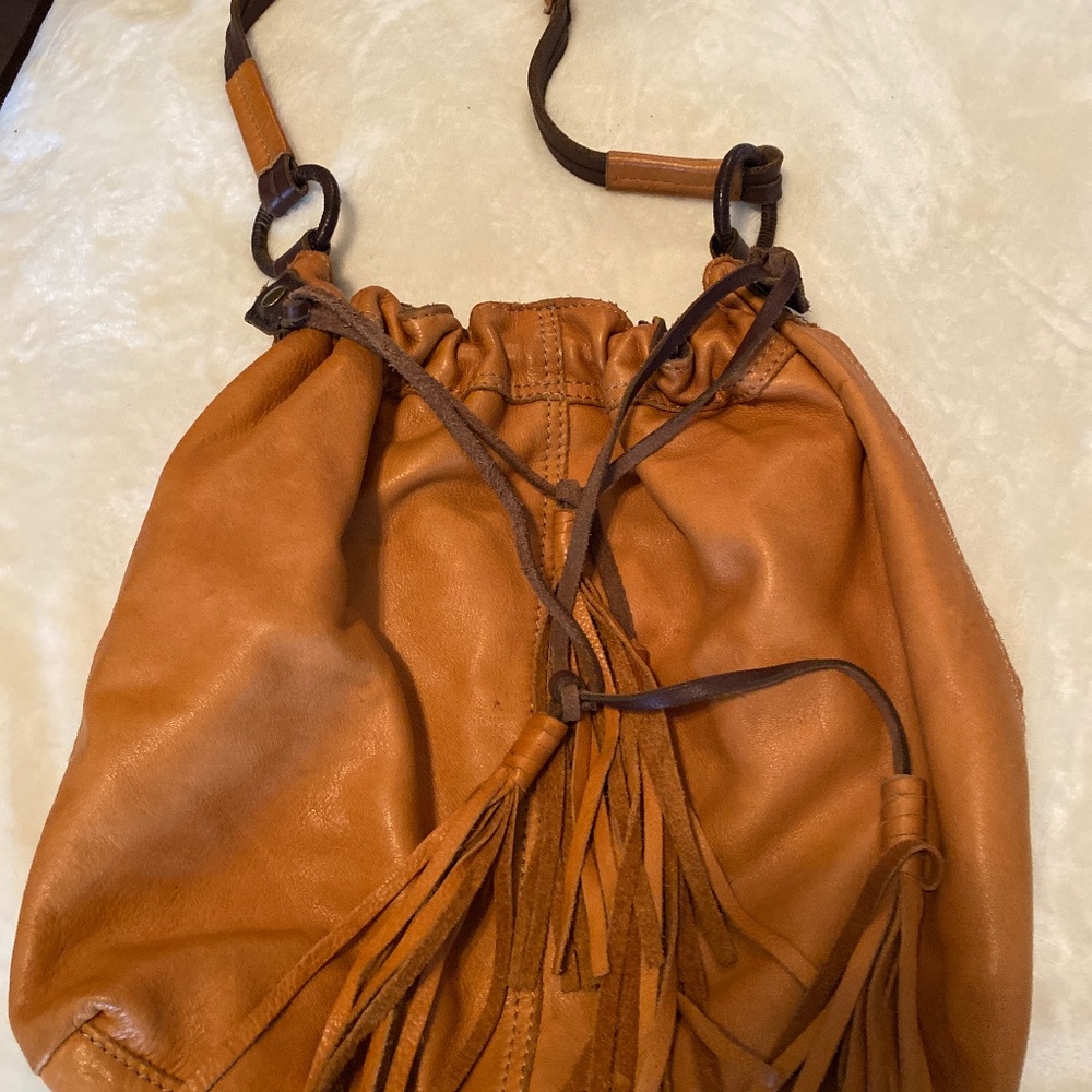 Lucky Brand soft tan leather medium shoulder bag with satchel accent .